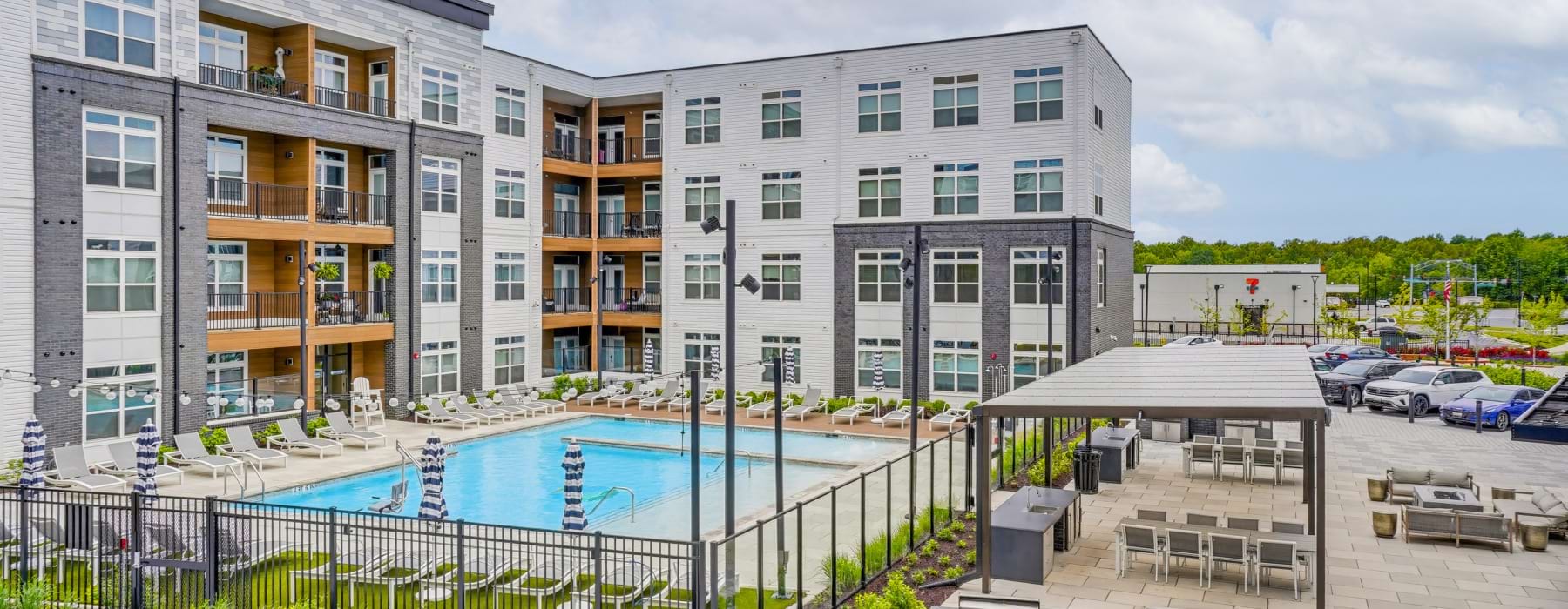 A pool in a courtyard between buildings