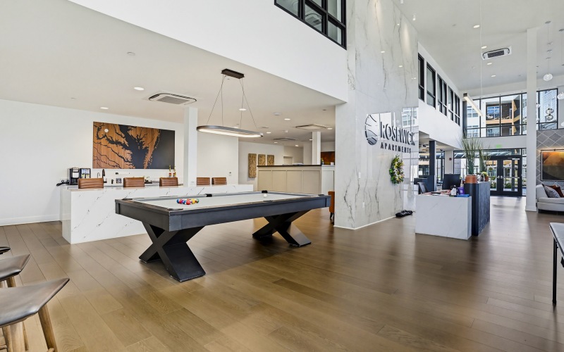 Beautiful clubroom with lounge seating and billiards