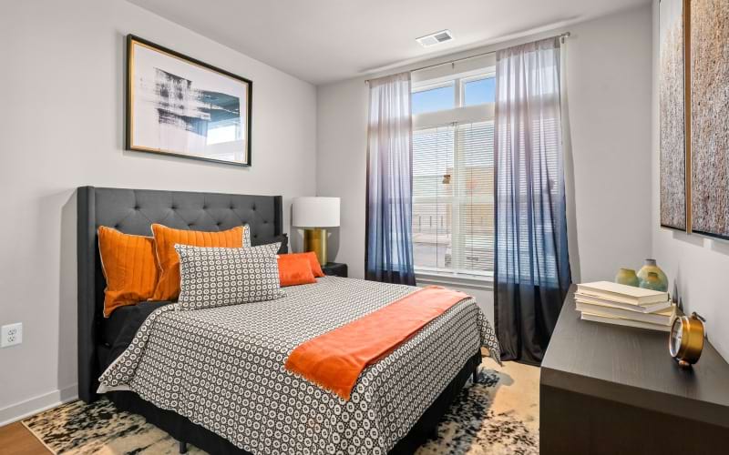 a bedroom with a bed and a desk