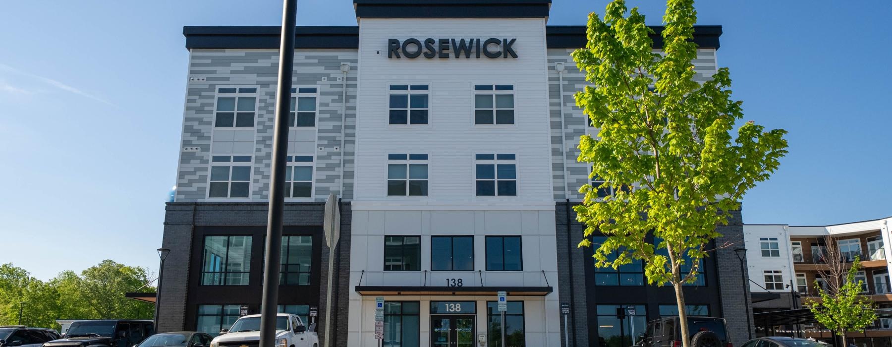a building with cars parked in front