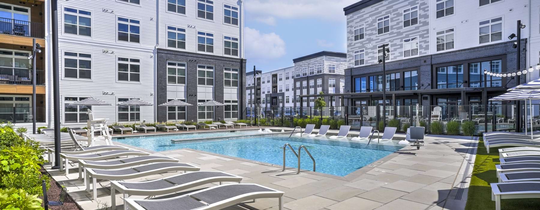 Resort-style swimming pool with lounge seating