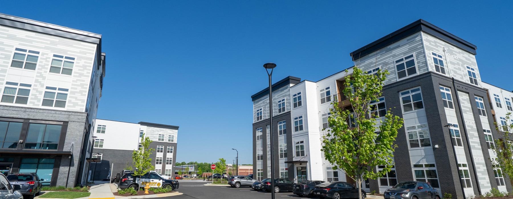 a street with cars and buildings along it