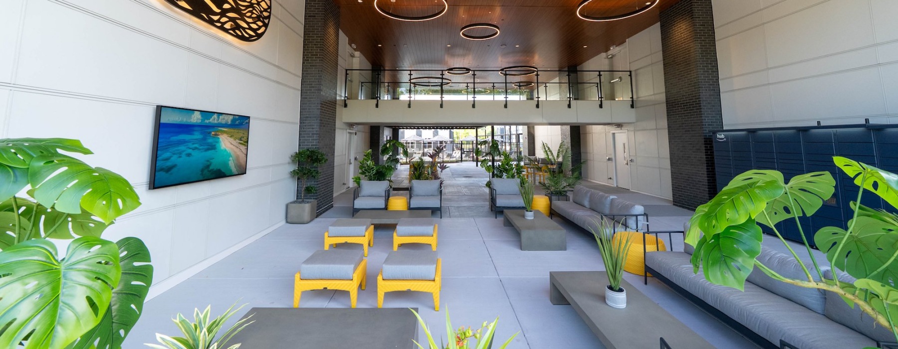 an outdoor patio with many seating areas and plants