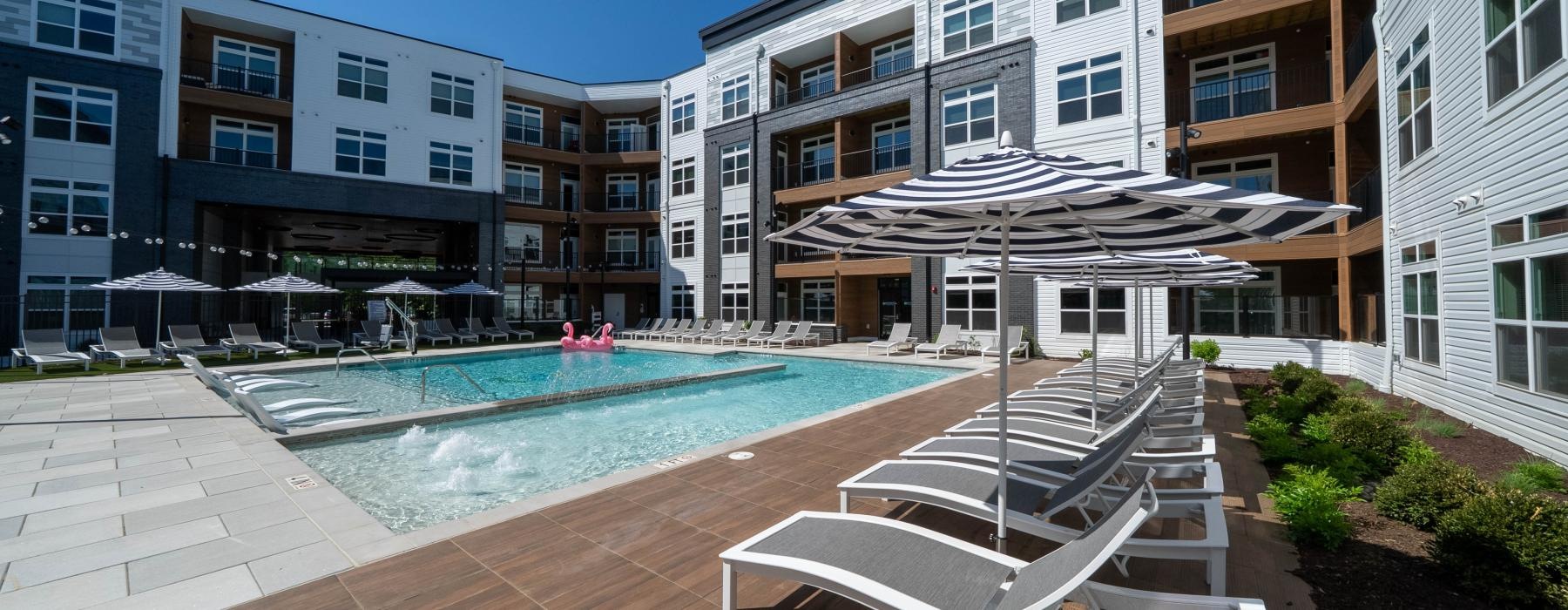 a pool in a courtyard between buildings